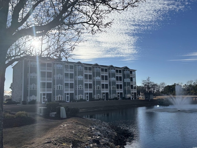 view of building exterior with a water view