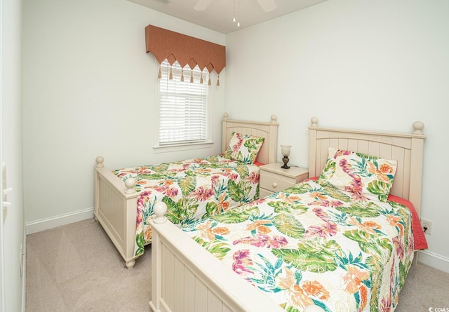 bedroom featuring baseboards, a ceiling fan, and light colored carpet