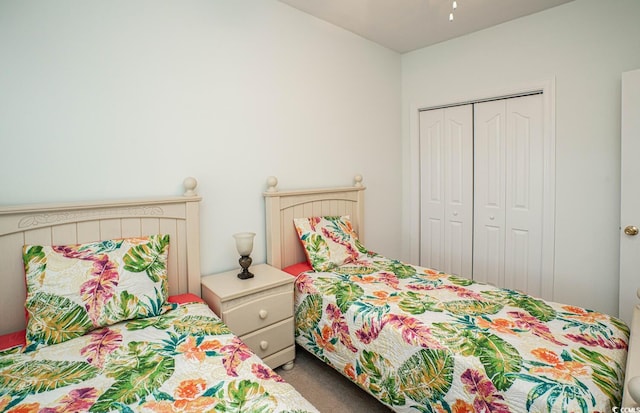 carpeted bedroom featuring a closet