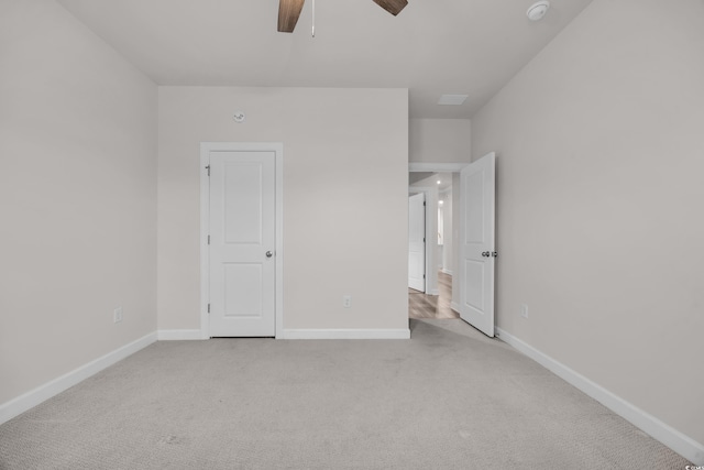 unfurnished bedroom with a ceiling fan, baseboards, and carpet flooring