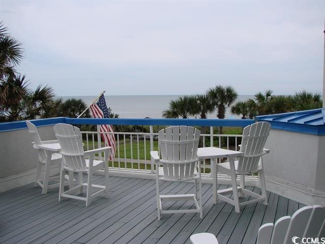 wooden terrace with a water view