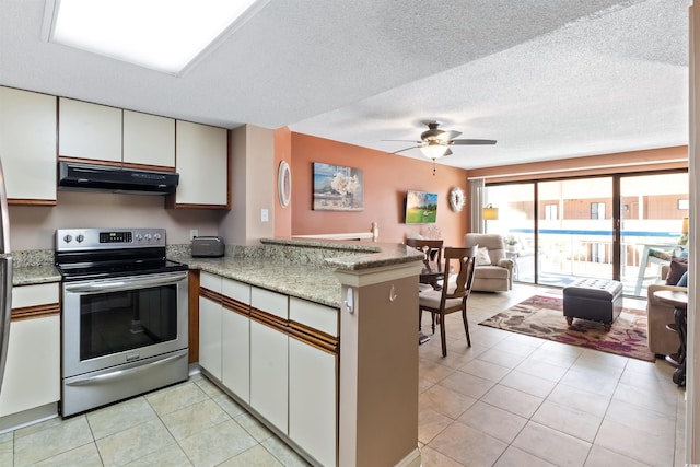 kitchen with electric stove, under cabinet range hood, white cabinetry, a peninsula, and light tile patterned floors