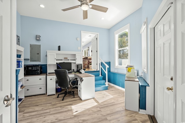 office space featuring recessed lighting, light wood-style flooring, and electric panel