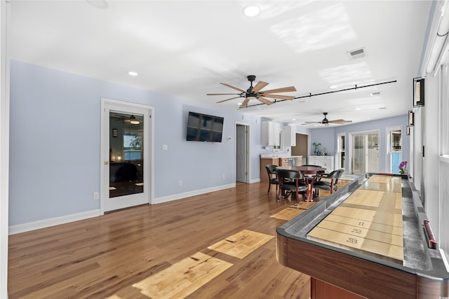 interior space featuring ceiling fan, recessed lighting, wood finished floors, visible vents, and baseboards