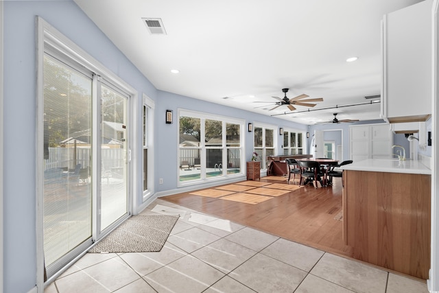 sunroom featuring visible vents