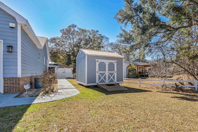 view of shed with fence