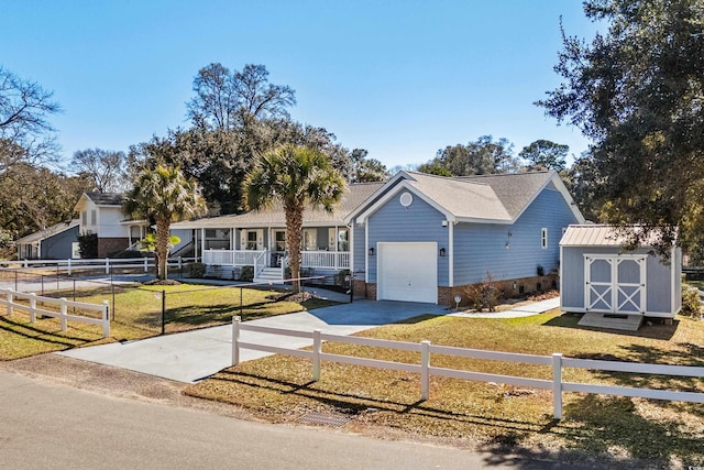 single story home featuring covered porch, a storage shed, a front yard, and fence