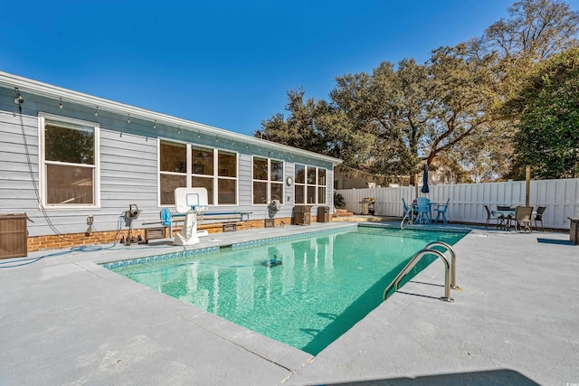 view of pool featuring a fenced backyard, a fenced in pool, and a patio