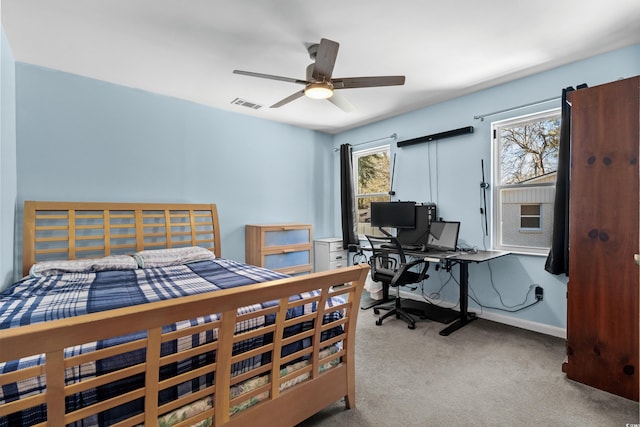 bedroom with visible vents, light carpet, and baseboards