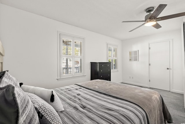 carpeted bedroom featuring a ceiling fan and baseboards