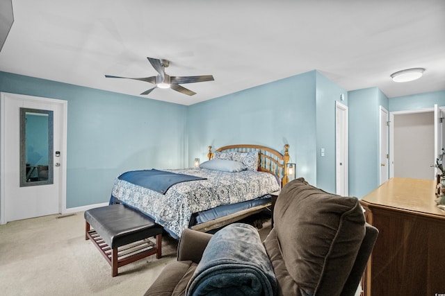 bedroom featuring light carpet, ceiling fan, visible vents, and baseboards