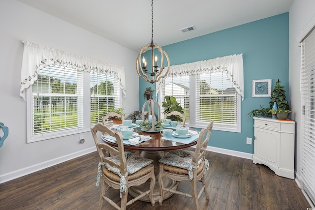 dining room featuring plenty of natural light, visible vents, dark wood finished floors, and baseboards