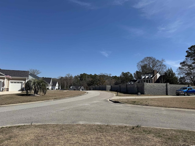 view of road featuring curbs and a residential view