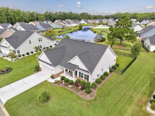 aerial view featuring a water view and a residential view