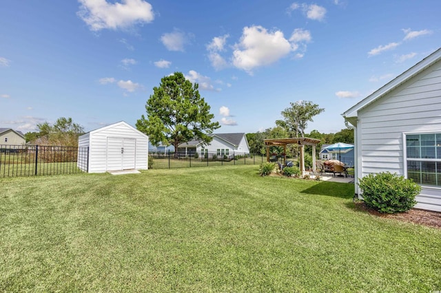 view of yard featuring an outbuilding, a fenced backyard, a storage shed, and a pergola