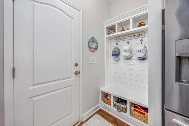 mudroom featuring baseboards and wood finished floors