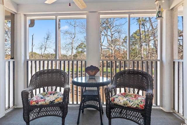 sunroom featuring ceiling fan