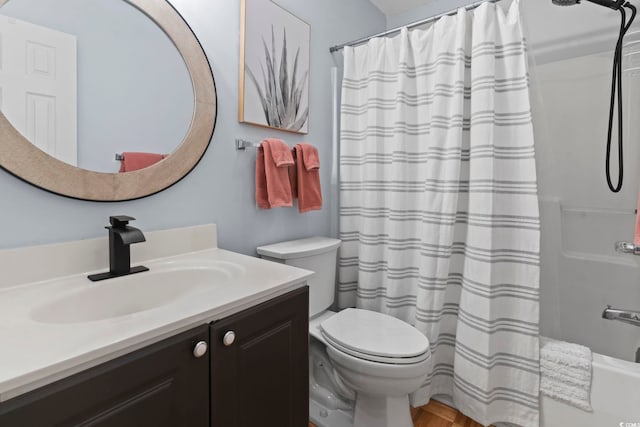 full bath featuring vanity, toilet, and shower / bath combo with shower curtain