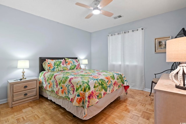 bedroom featuring baseboards, visible vents, and a ceiling fan