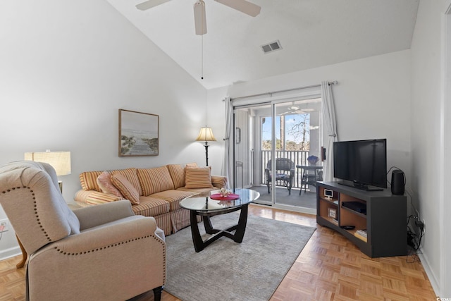 living room with high vaulted ceiling, visible vents, and ceiling fan