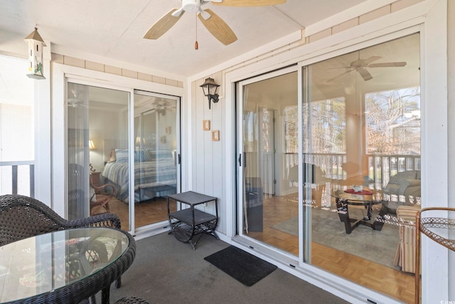 sunroom with a ceiling fan