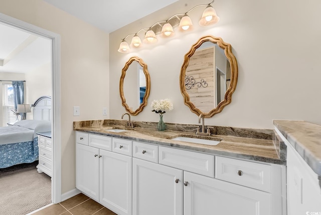 full bathroom with a sink, tile patterned flooring, double vanity, and connected bathroom