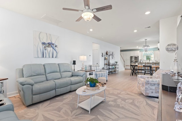 2476 Blue Crane Cir Unit 101, Myrtle Beach, SC 29577 - living area with visible vents, recessed lighting, light wood-style floors, ceiling fan, and stairway