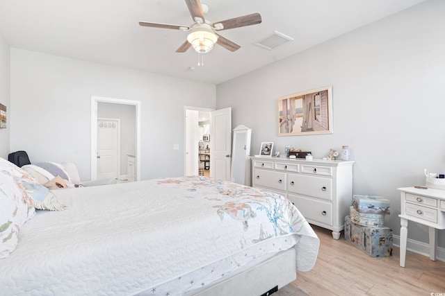 2476 Blue Crane Cir Unit 101, Myrtle Beach, SC 29577 - bedroom with ensuite bathroom, ceiling fan, light wood-style flooring, baseboards, and visible vents