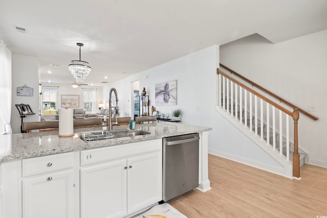 2476 Blue Crane Cir Unit 101, Myrtle Beach, SC 29577 - kitchen with dishwasher, white cabinetry, a sink, open floor plan, and a notable chandelier