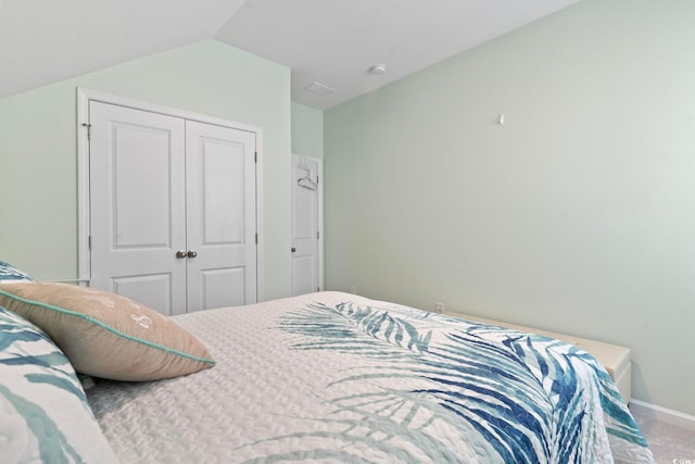 2476 Blue Crane Cir Unit 101, Myrtle Beach, SC 29577 - carpeted bedroom with lofted ceiling, a closet, and baseboards
