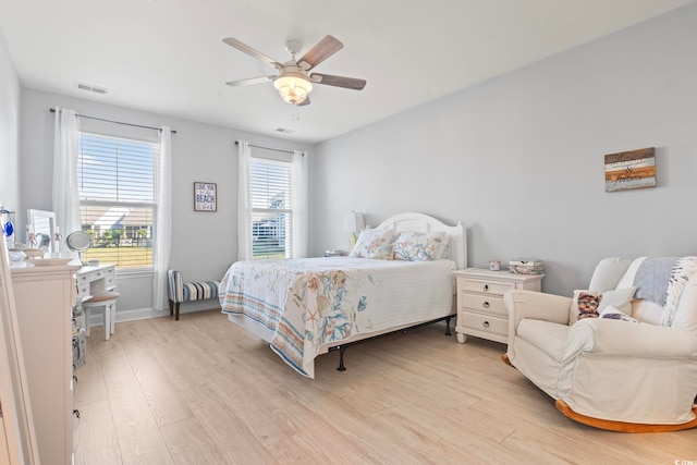 2476 Blue Crane Cir Unit 101, Myrtle Beach, SC 29577 - bedroom featuring visible vents, light wood finished floors, baseboards, and a ceiling fan