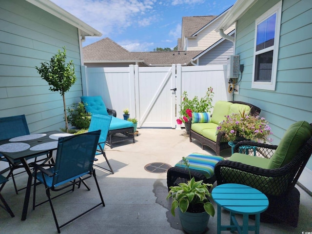 2476 Blue Crane Cir Unit 101, Myrtle Beach, SC 29577 - view of patio / terrace featuring a gate, outdoor dining area, and fence