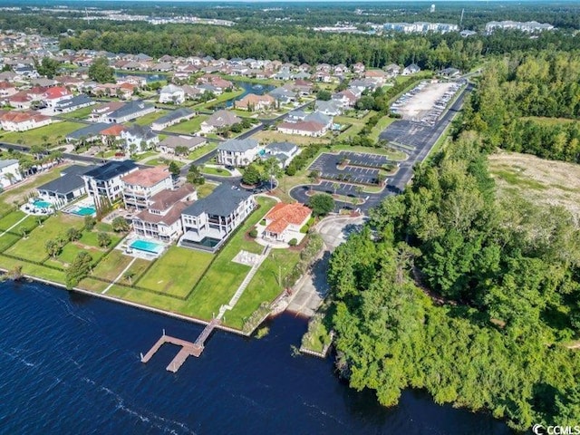 bird's eye view with a water view and a forest view