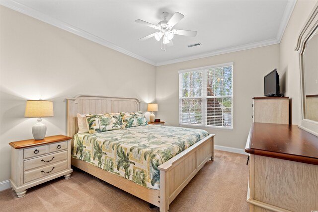 bedroom with crown molding, visible vents, light carpet, ceiling fan, and baseboards