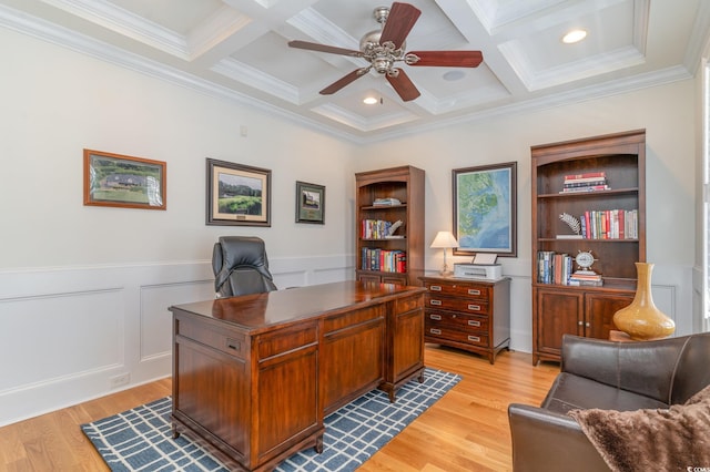 office featuring light wood-style flooring, a ceiling fan, ornamental molding, coffered ceiling, and beamed ceiling