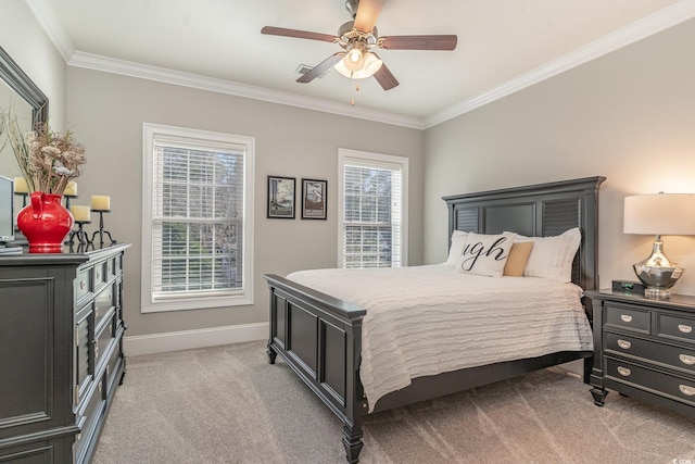 bedroom featuring baseboards, carpet flooring, a ceiling fan, and crown molding