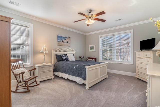 bedroom with ornamental molding, light colored carpet, visible vents, and baseboards