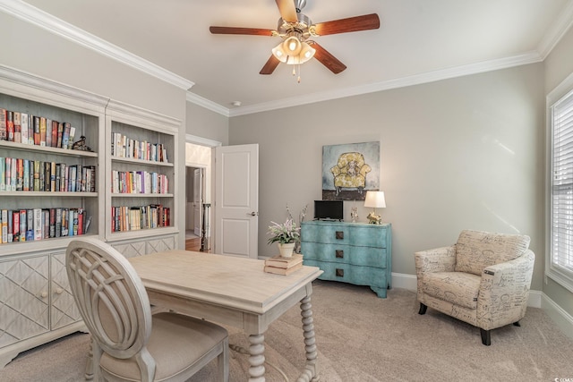 office area featuring ornamental molding, light carpet, baseboards, and a ceiling fan