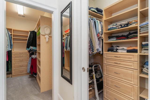 spacious closet featuring carpet floors and visible vents