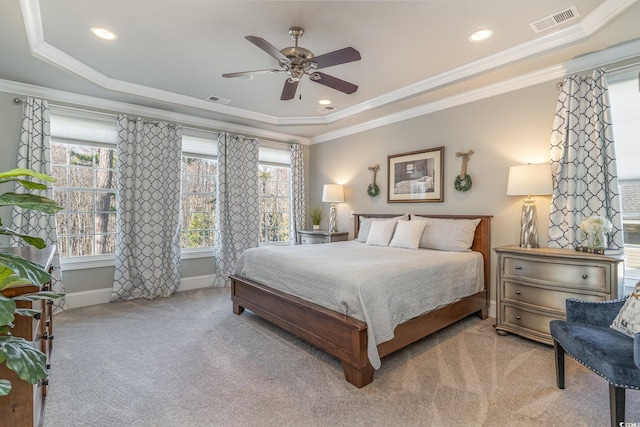 bedroom with ornamental molding, visible vents, light carpet, and baseboards