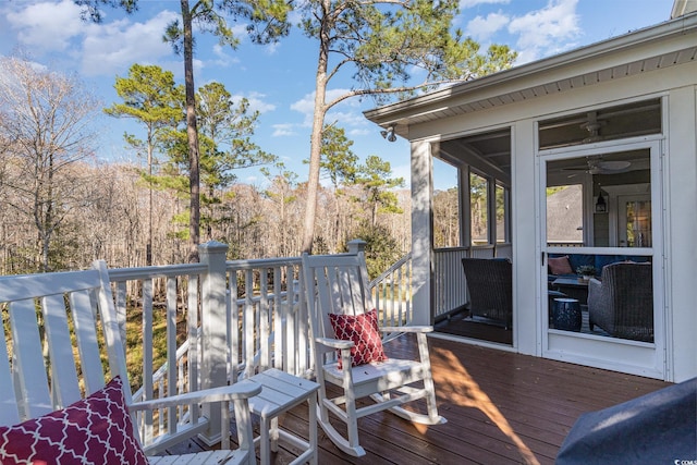 wooden terrace featuring a sunroom