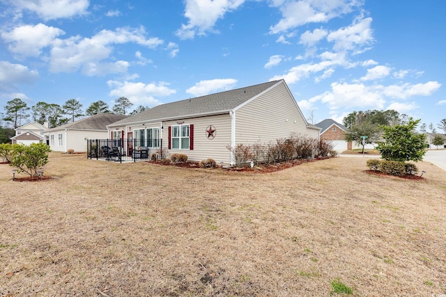 rear view of house with a yard