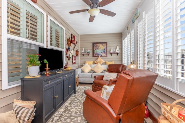 sitting room featuring ceiling fan