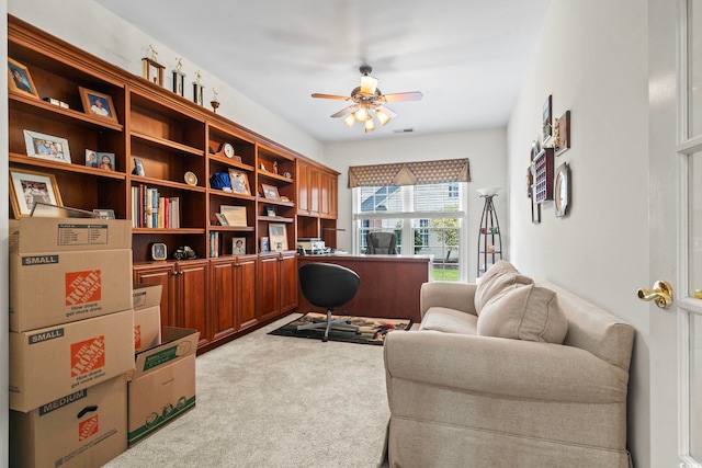 sitting room featuring visible vents, a ceiling fan, and carpet flooring