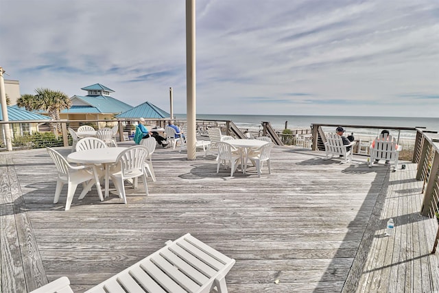 wooden deck featuring a water view