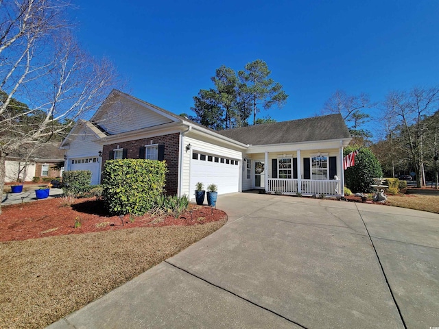 single story home with driveway, brick siding, and an attached garage