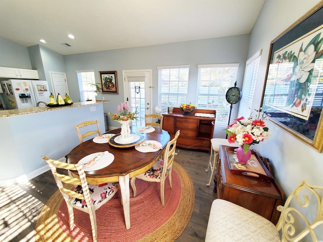 dining area featuring visible vents, dark wood-style flooring, and recessed lighting