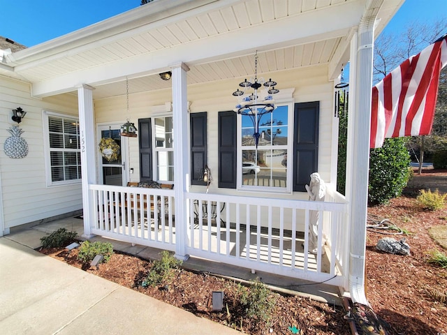 property entrance with covered porch