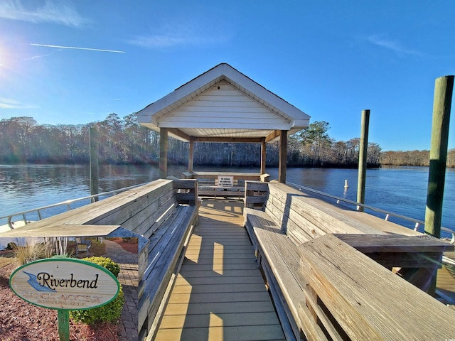 view of dock featuring a water view and a gazebo