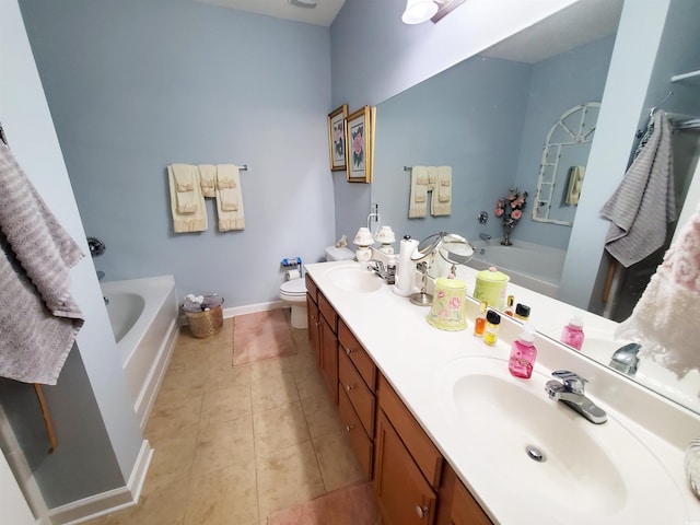 bathroom featuring a bath, tile patterned flooring, double vanity, and a sink